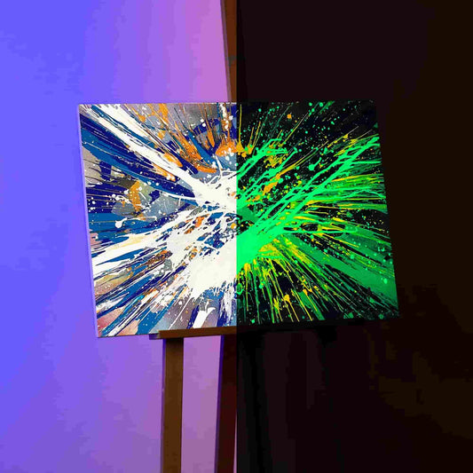 Split-view of acrylic paints masterpiece on Italian canvas: Daytime's vibrant painting contrasts the ethereal glow in the dark spin art paint effect.
